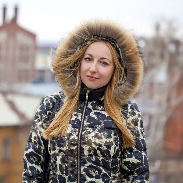 Young beautiful blonde woman in fur hood — Stock Photo, Image