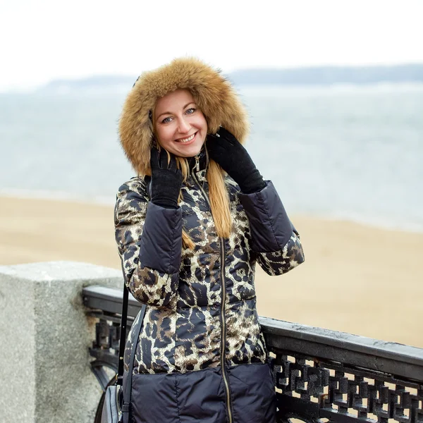 Young beautiful blonde woman in fur hood — Stock Photo, Image