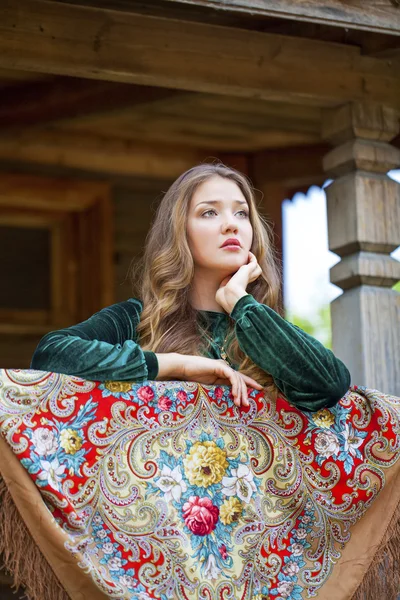 Beauty woman in the national patterned scarf — Stock Photo, Image