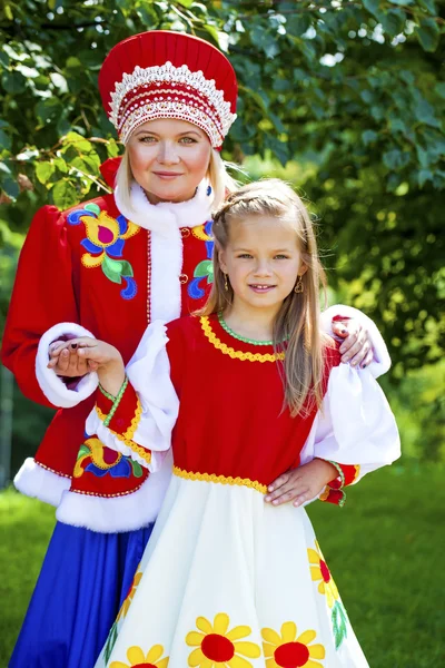 Portrait of mother and daughter in a national Russian costume — Stock Photo, Image