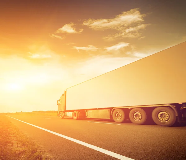 Truck on asphalt road motion blur — Stock Photo, Image