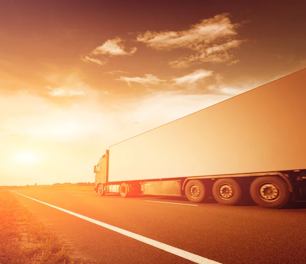 Truck on asphalt road motion blur — Stock Photo, Image