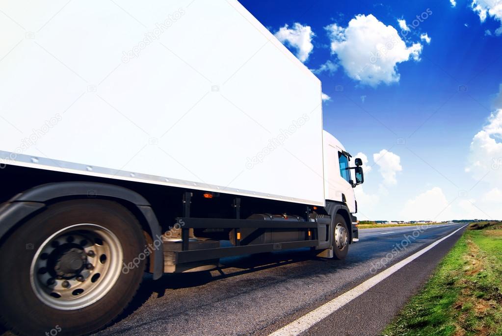 White truck on the asphalt road