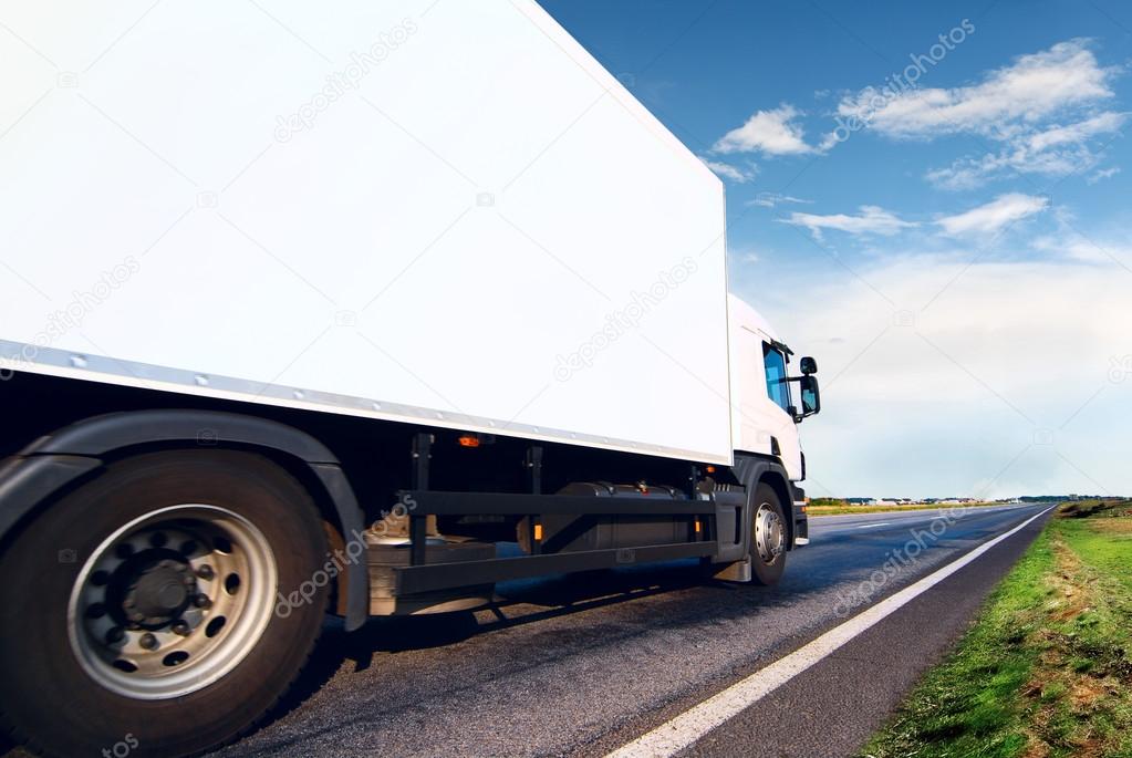 White truck on  asphalt road