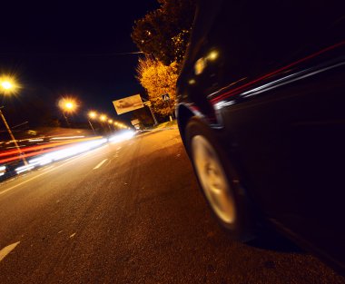 Highway at night with light trails clipart