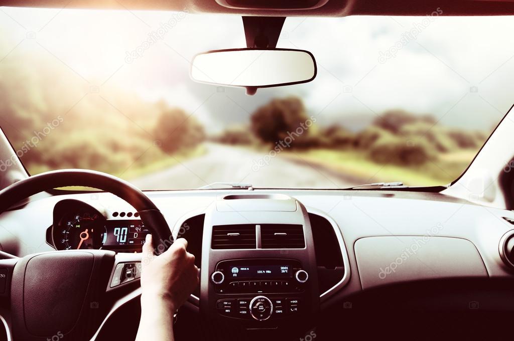 Driver hands on steering wheel