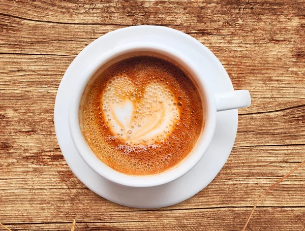 Coffee cup with heart shaped foam — Stock Photo, Image