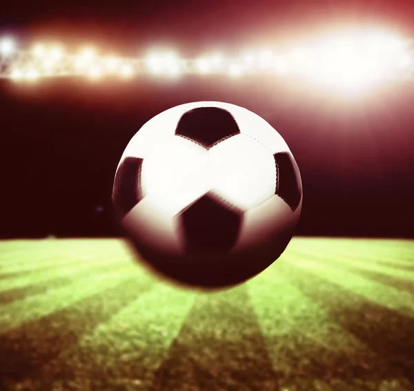 Soccer ball on stadium — Stock Photo, Image