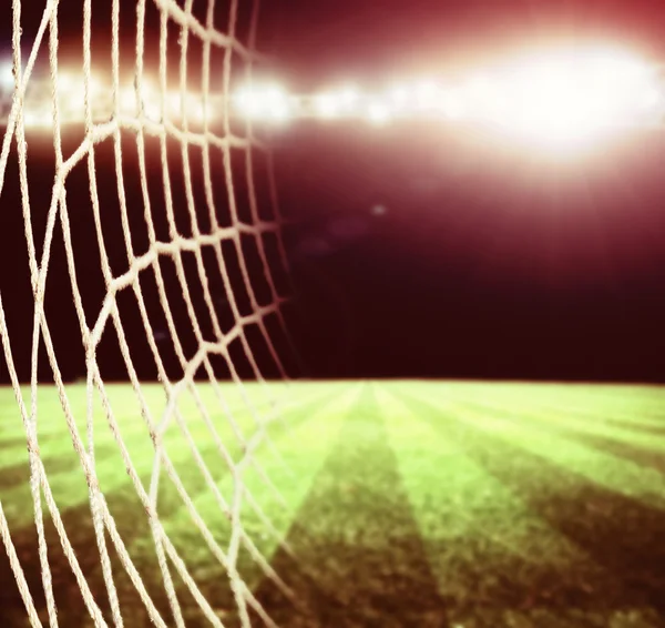 Starkt ljus på natten och soccer stadium — Stockfoto