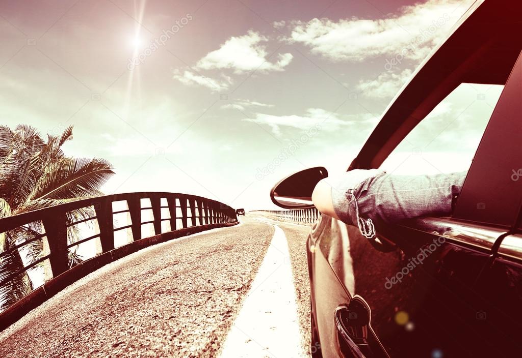 arriving on car to the tropical beach