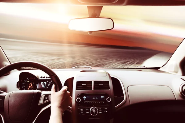 Driver's hand on steering wheel — Stock Photo, Image