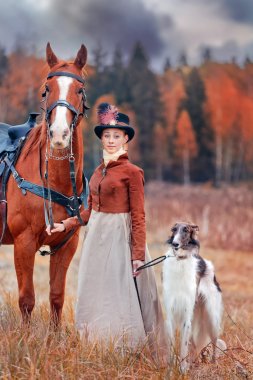 Lady in riding habbit  at horse hunting clipart