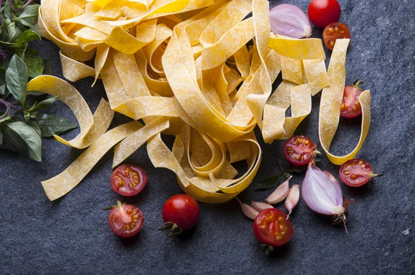 Dry tagliatelle pasta — Stock Photo, Image