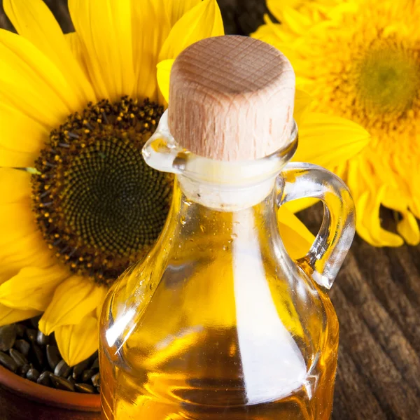 Sunflowers with oil — Stock Photo, Image