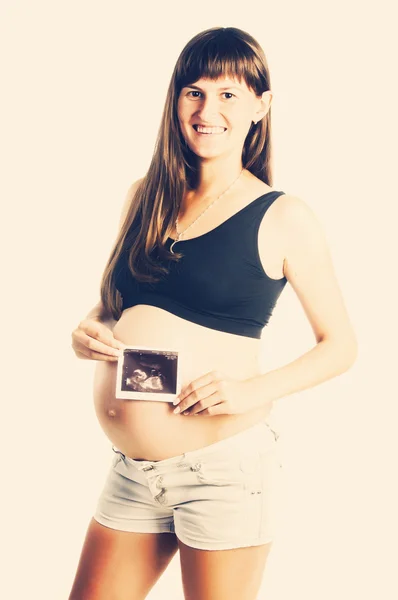 Pregnant woman with ultrasound scan — Stock Photo, Image