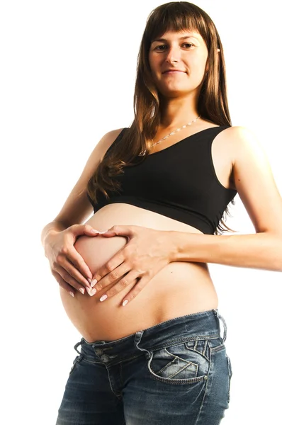 Mulher grávida fazendo gesto de coração — Fotografia de Stock