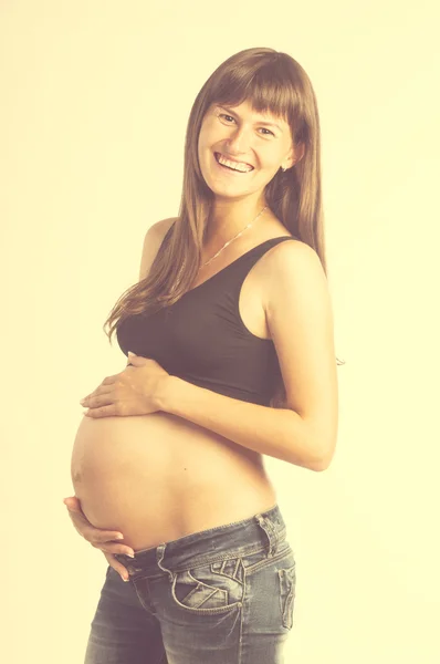 Mulher grávida segurando sua barriga — Fotografia de Stock