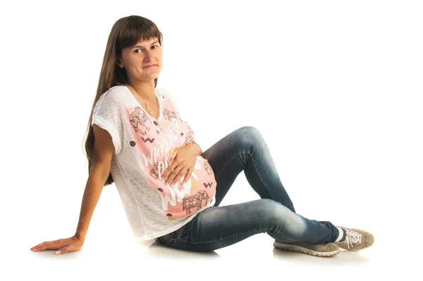 Pregnant woman sitting on floor — Stock Photo, Image