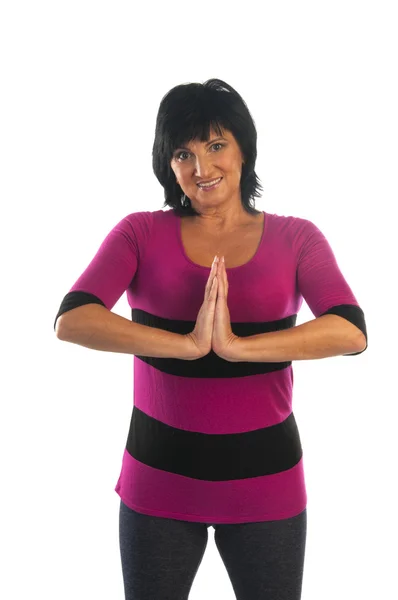 Moden kvinde gør Namaste mudra gestus - Stock-foto