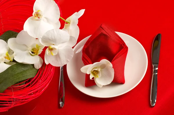 Table setting with orchid flowers — Stock Photo, Image