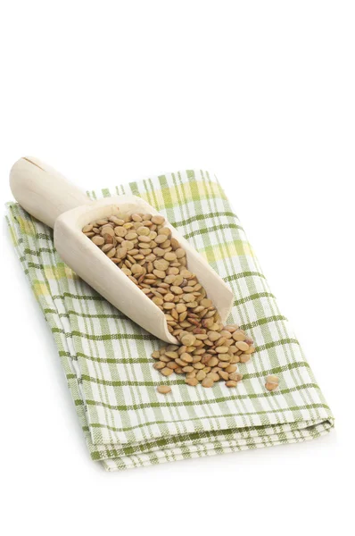 Green lentil seeds in scoop — Stock Photo, Image