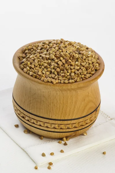 Buckwheat groats in wood pot — Stok Foto