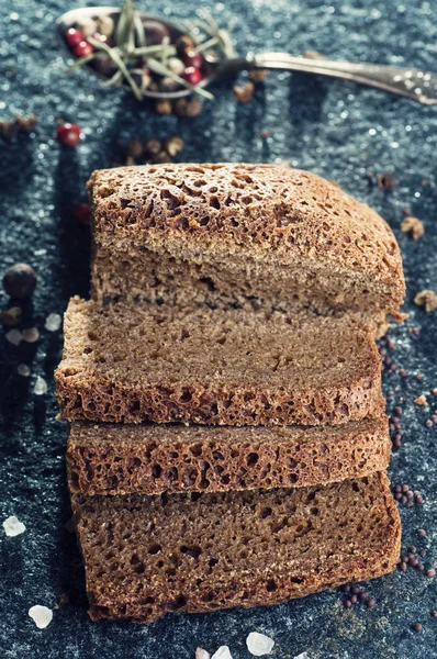 Slices of bread on stone background