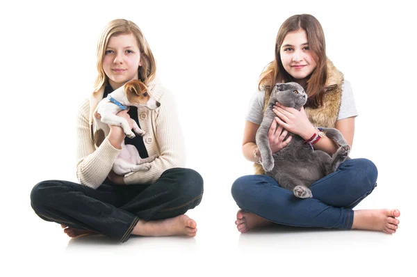 Girls holding pets: cat and dog — Stock Photo, Image