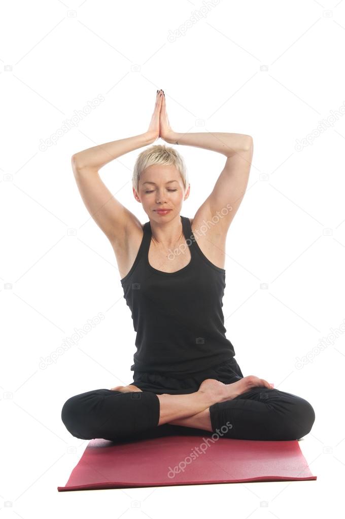 Woman in yoga Lotus pose Padmasana