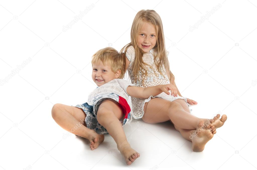 Little boy and girl lying