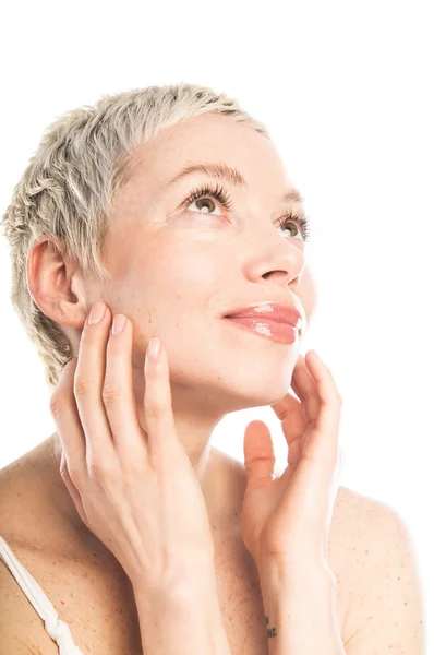 Woman touching her face — Stock Photo, Image