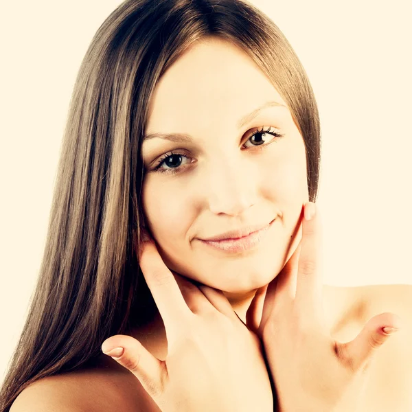 Girl touching her face — Stock Photo, Image