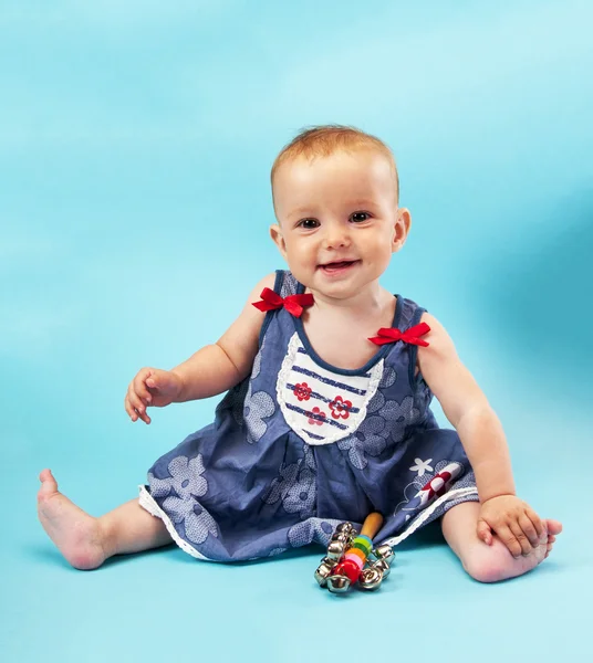 Baby girl on blue background — Stock Photo, Image