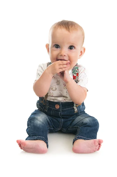 Cute baby girl sitting on the floor — Stock Photo, Image