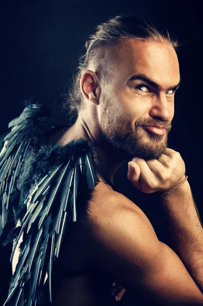 Funny man with black wings — Stock Photo, Image