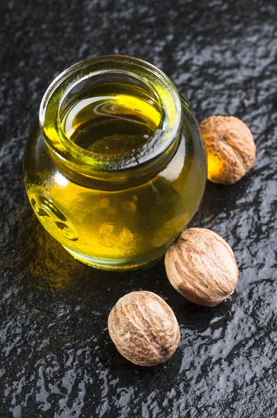 Nutmeg oil in jar — Stock Photo, Image