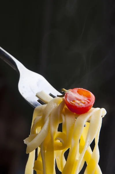 Hot italian pasta rolled on a fork — Stock Photo, Image