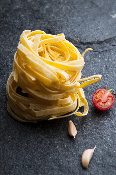 Dry tagliatelle pasta — Stock Photo, Image