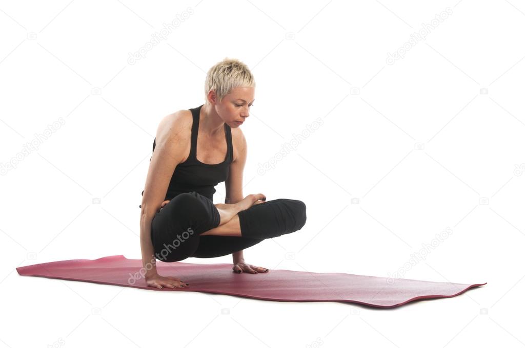 Woman in Tolasana (Scale) yoga Pose