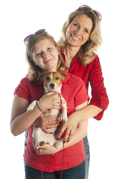 Woman and girl with puppy — Stock Photo, Image