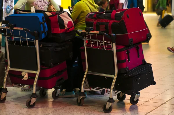 Luggage at carts in airport — Stock Photo, Image