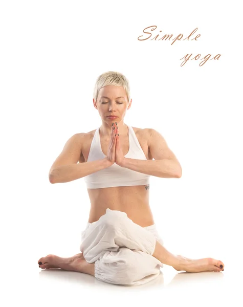 Woman in yoga Gomukhasana pose — Stock Photo, Image