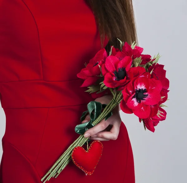 Female hands with hand made flowers — Stock Photo, Image