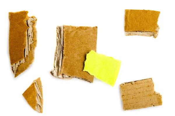 Torn cardboard pieces — Stock Photo, Image