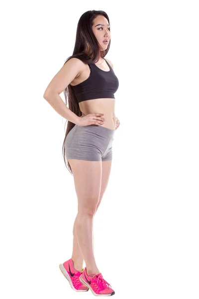 Beautiful fitness woman standing - isolated over a white backgro — Stock Photo, Image