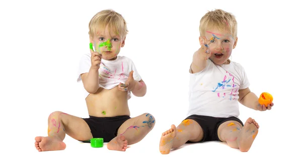 Twins playing with paint — Stock Photo, Image