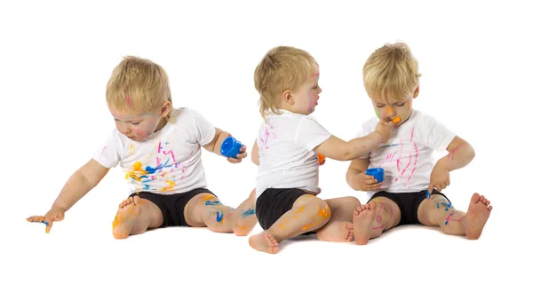 Twins playing with paint — Stock Photo, Image