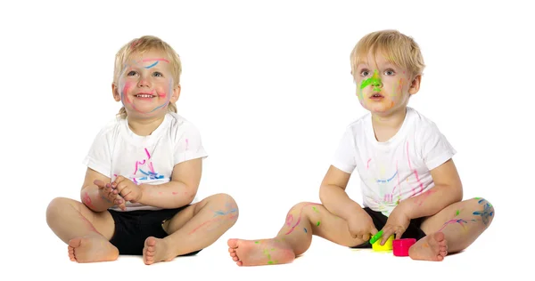 Twins playing with paint — Stock Photo, Image