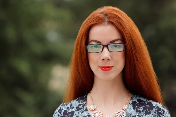 Ginger woman close up portrait on green background — Stock Photo, Image