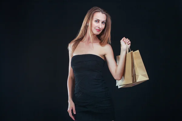 Mujer rubia con bolsas de compras —  Fotos de Stock